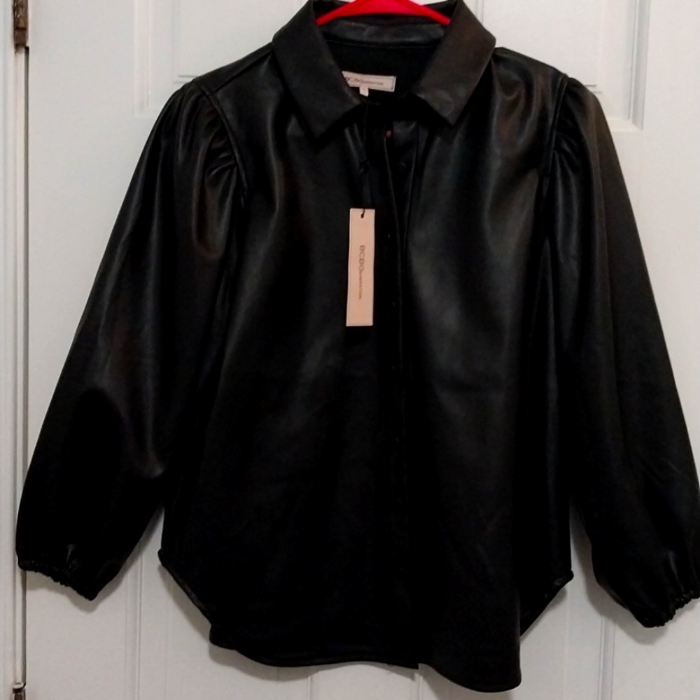 Bcbg faux leather top inside soft lined color black xs size never worn .